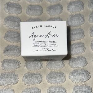 Earth Aqua Aura Eye Creme in White and Blue